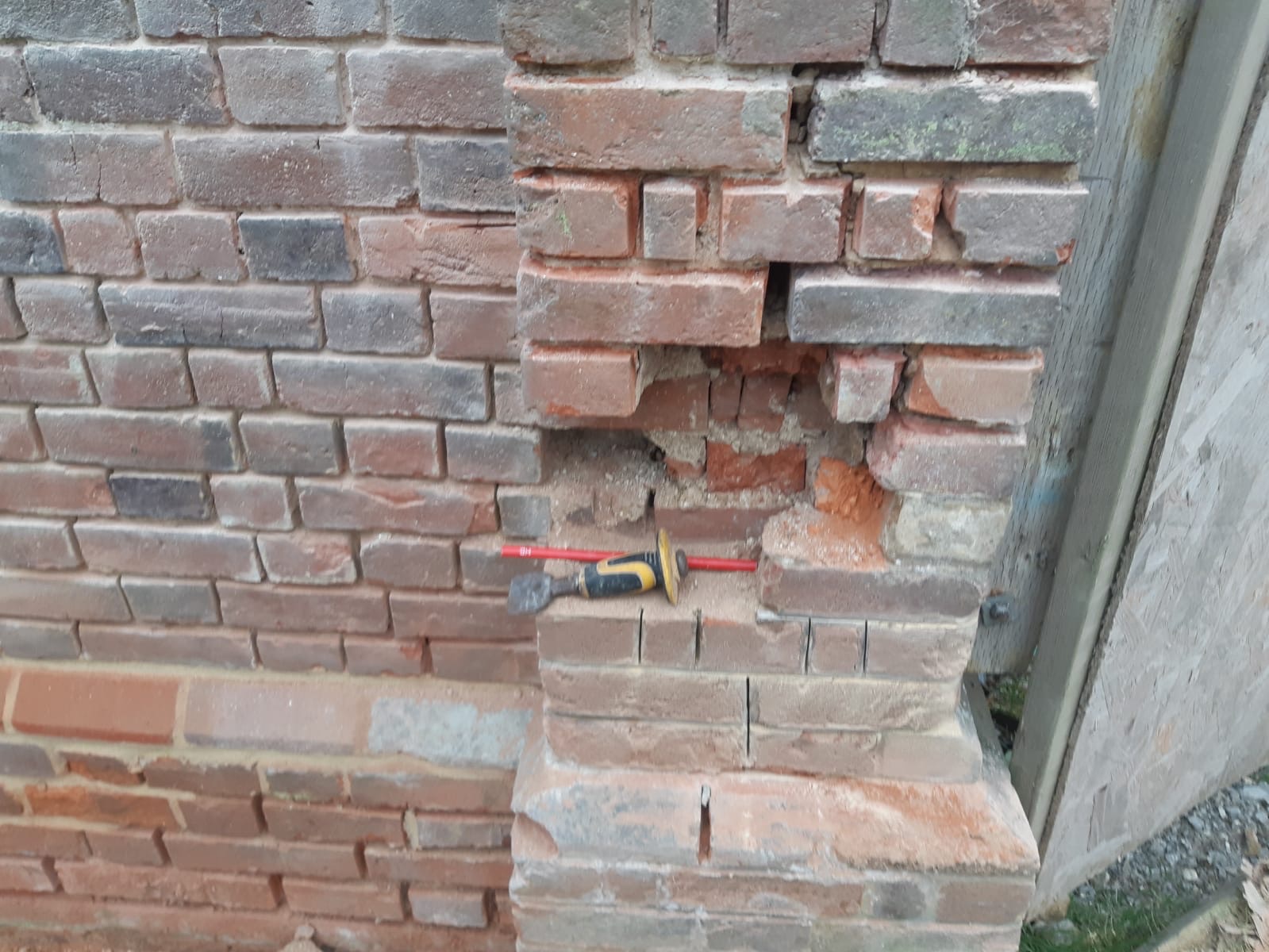 Heritage brick repair work showing traditional craftsmanship